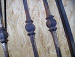 Wrought-iron banister needs coating. (2)